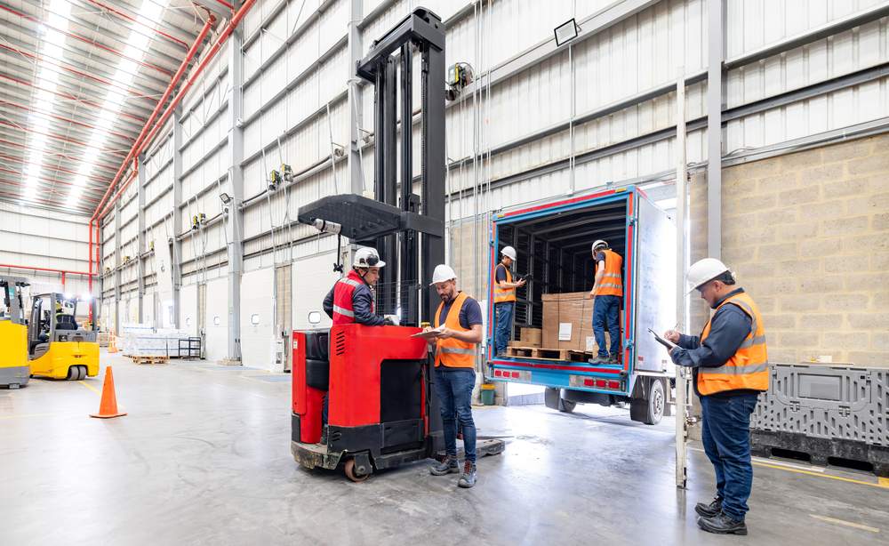 Warehouse team loading a shipment onto a truck for dispatch