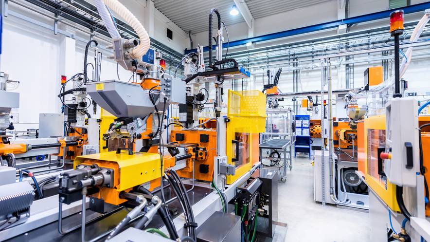 Automated injection moulding machines on a plastics production line