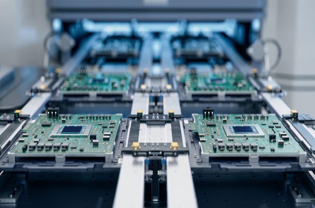 Automated PCB assembly line in an electronics manufacturing facility
