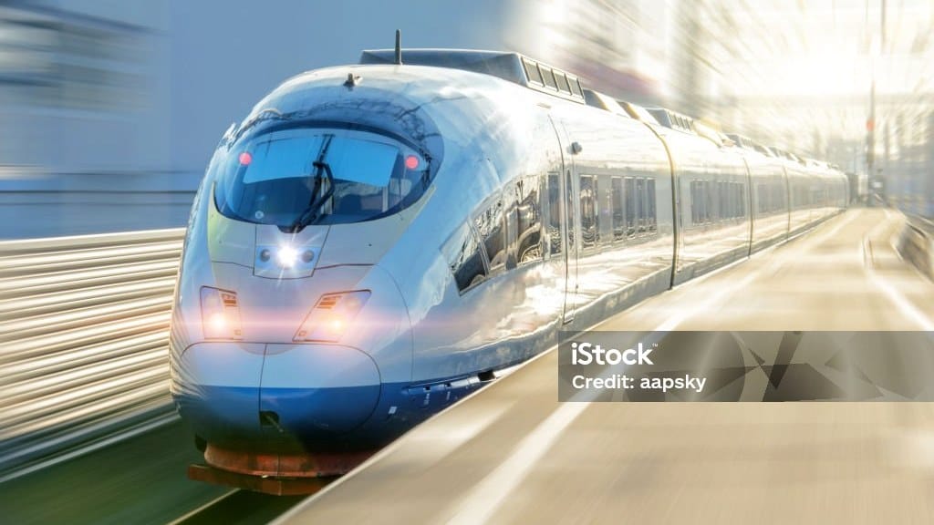 High-speed electric passenger train departing a station platform